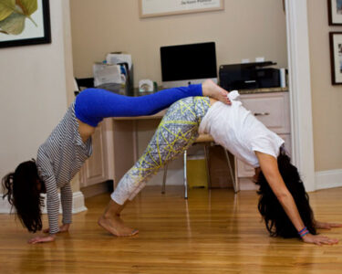 A Parent-Child Partner Yoga Sequence for Mother's Day Image